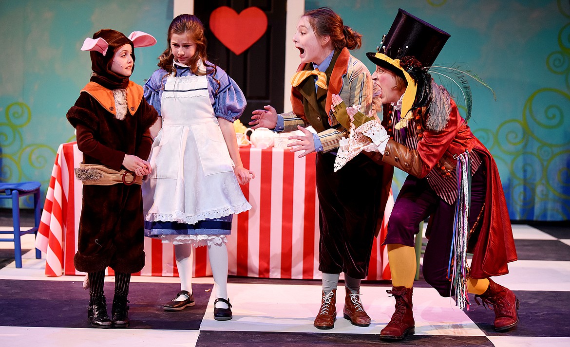 From left, Madeline Spear as the Dormouse, Simma Lefcourt as Alice, Scarlet Burke as the March Hare and Jill Dieser as the Mad Hatter in the dress rehearsal for Whitefish Theatre Company&#146;s production of &#147;Alice in Wonderland&#148; on Tuesday at the O&#146;Shaughnessy Center in Whitefish. (Brenda Ahearn photos/Daily Inter Lake)