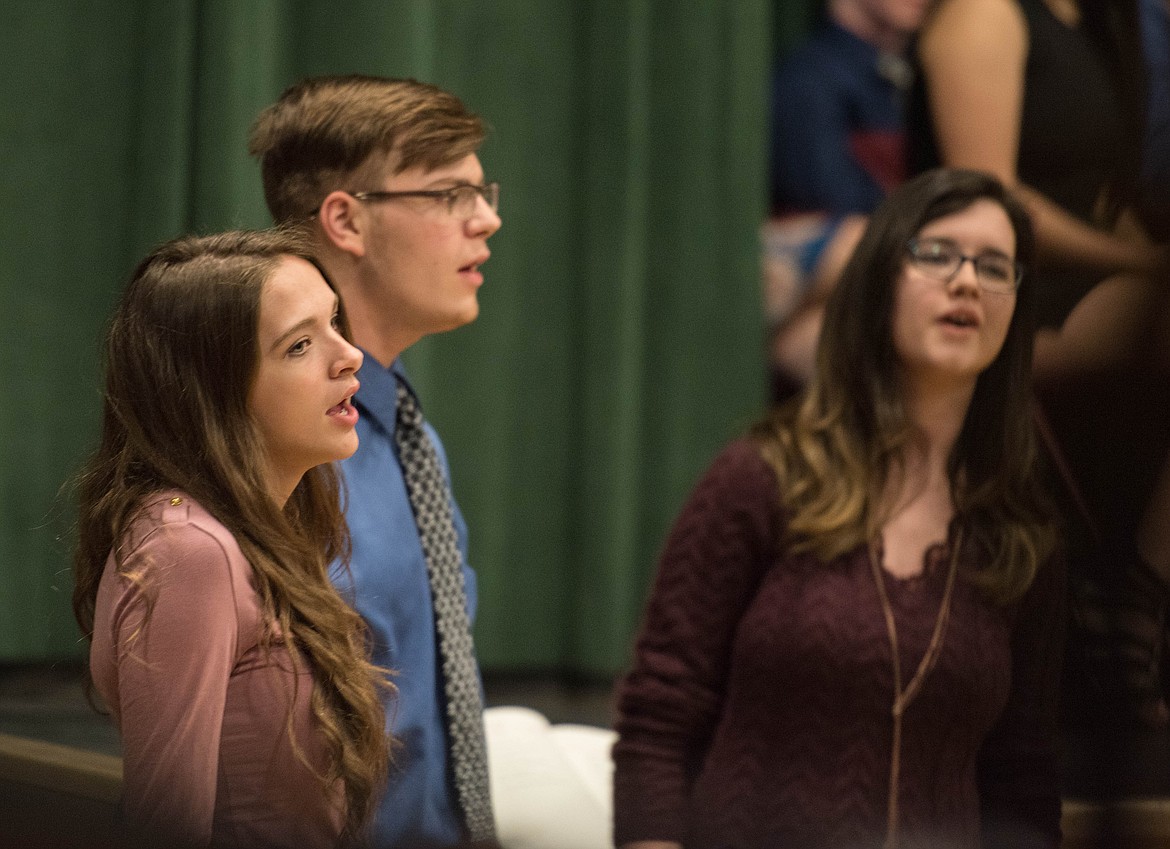 Mikalyn Zeiler, Kaleb Lindgren and Sophie Lee perform &quot;Shenandoah&quot; at the National Honor Society 2019 induction ceremony, April 8 at the Libby Memorial Events Center.