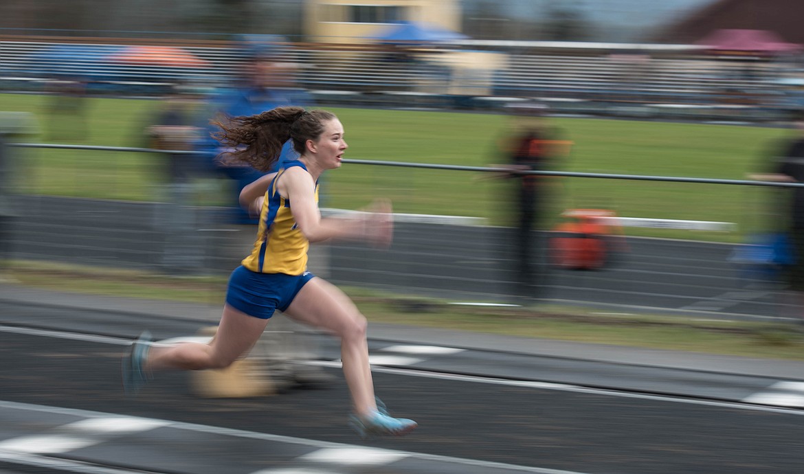 Libby senior Emma Gruber speeds into the long jump, Saturday at the Libby Invitational. (Luke Hollister/The Western News)