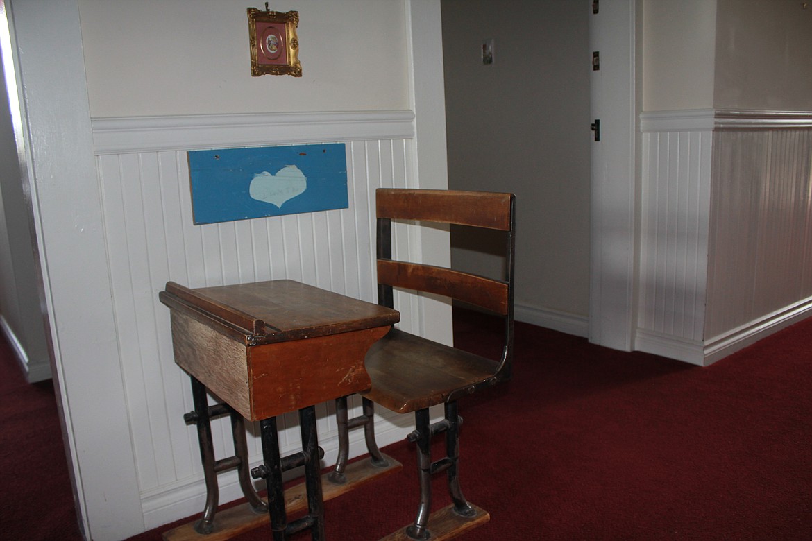 Photo by TANNA YEOUMANS
This old school desk is flanked by a piece of history in the form of a love declaration from one former student about another.