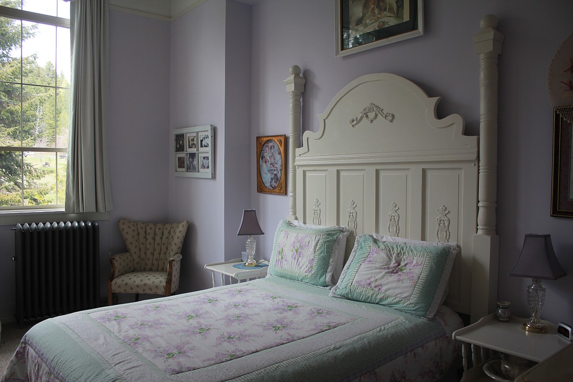 Photo by TANNA YEOUMANS
This headboard was crafted from wooden and other pieces found throughout the property, bringing the lavendar Meeker room a touch more history.