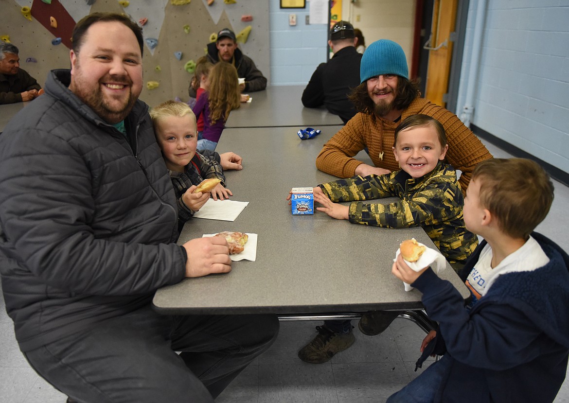 THREE CHERRY Valley students from Helen Siemers&#146; kindergarten class enjoyed donuts with their dads. From left are Paul (dad) and Liam Venters; Randy (dad) and Fritz Lachman; and Tucker Basler. Paul and Randy are CVE Watch D.O.G.S.