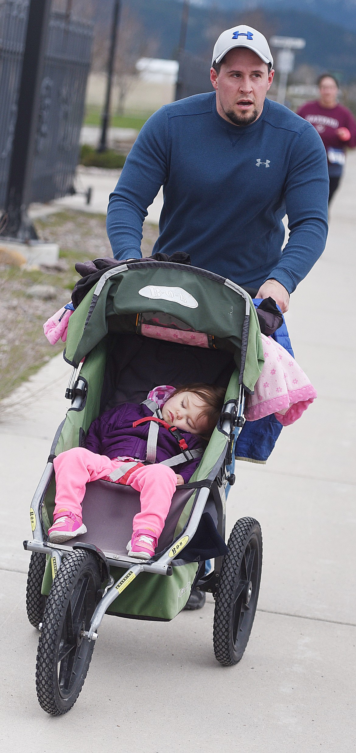 NAP TIME for this little girl in the stroller toward the end of one of the Buttercup Run&#146;s longer races Saturday at Arlee. The driver of the stroller did not have a number and was not identified.