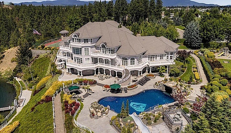 The &quot;Amway house&quot; on the Spokane River in Post Falls includes 13 bedrooms and 13 bathrooms. (Courtesy photo via Century21.com)