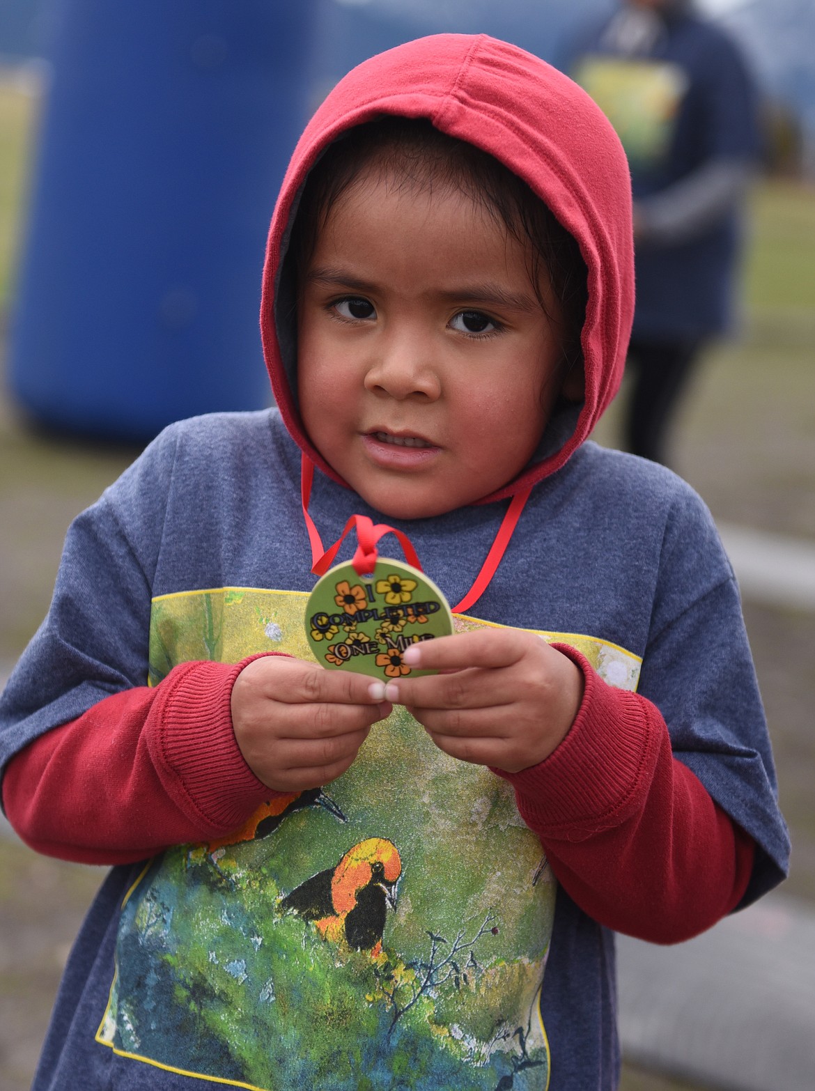 FOUR-YEAR-OLD Chonte Pete shows the medal he received for finishing the 1-mile Fun Run. It was his first time in the Buttercup Run.