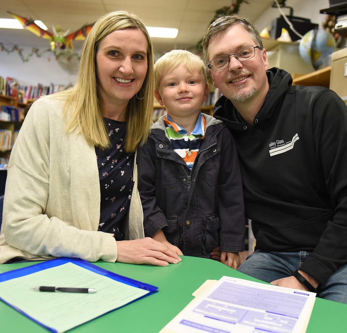 ROKTON WALTER is flanked by his parents Brad and Heather during the Cherry Valley Kindergarten Roundup on April 11 in Polson. Rokton now attends Scribbles Pre-School.