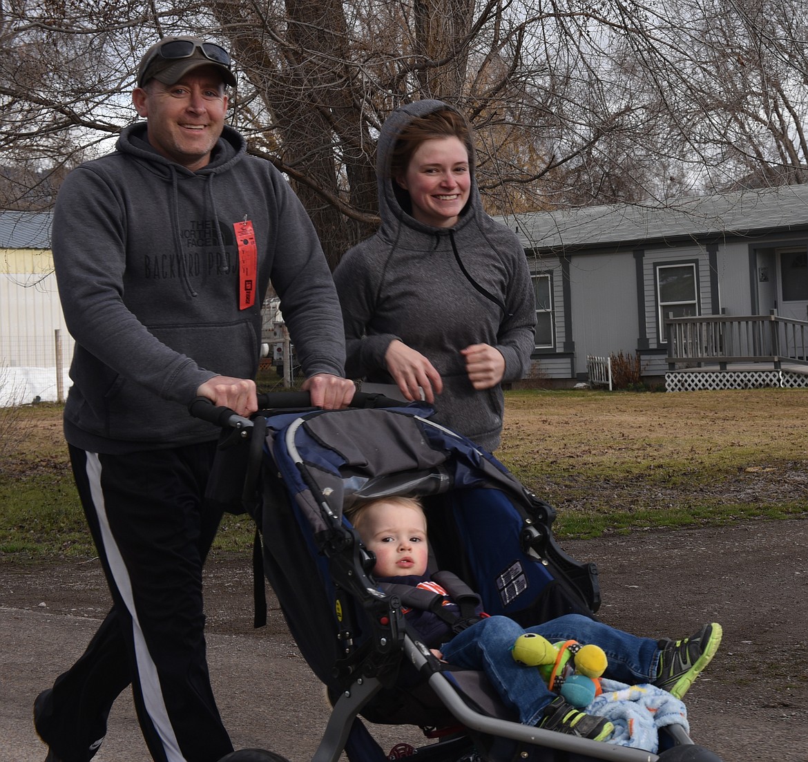 MATTHEW MARRINAN, Chelsey Bourdan stride out with their baby during the Bison Stampede 5K. This is 17-month-old&#146;s second Stampede.