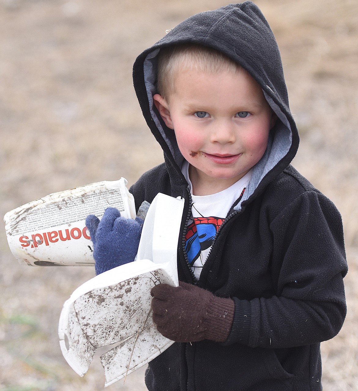 THREE-YEAR-OLD Boyd Smith was up to the task of colleting trash along the Buttercup Run course.