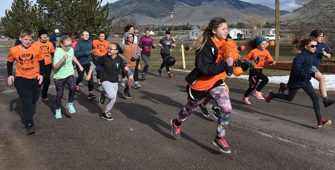 &quot;FRONT RUNNERS&quot; take off on the Dixon Bison Stampede 5K. Pictured from left are Derek Walker, Reese Swensen, Lucy Metcalf, Jayna Hale, Abbi Wagner, Dylann Elverud and Kristy Porter. (Carolyn Hidy photos/Clark Fork Valley Press)