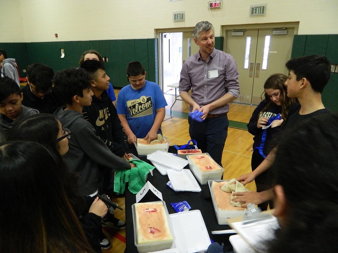 Rachal Pinkerton/Sun Tribune
Dr. Jeff Haney, the clinical education director for family medicine at the WSU Elson S. Floyd College of Medicine, teaches students how to stop bleeding.