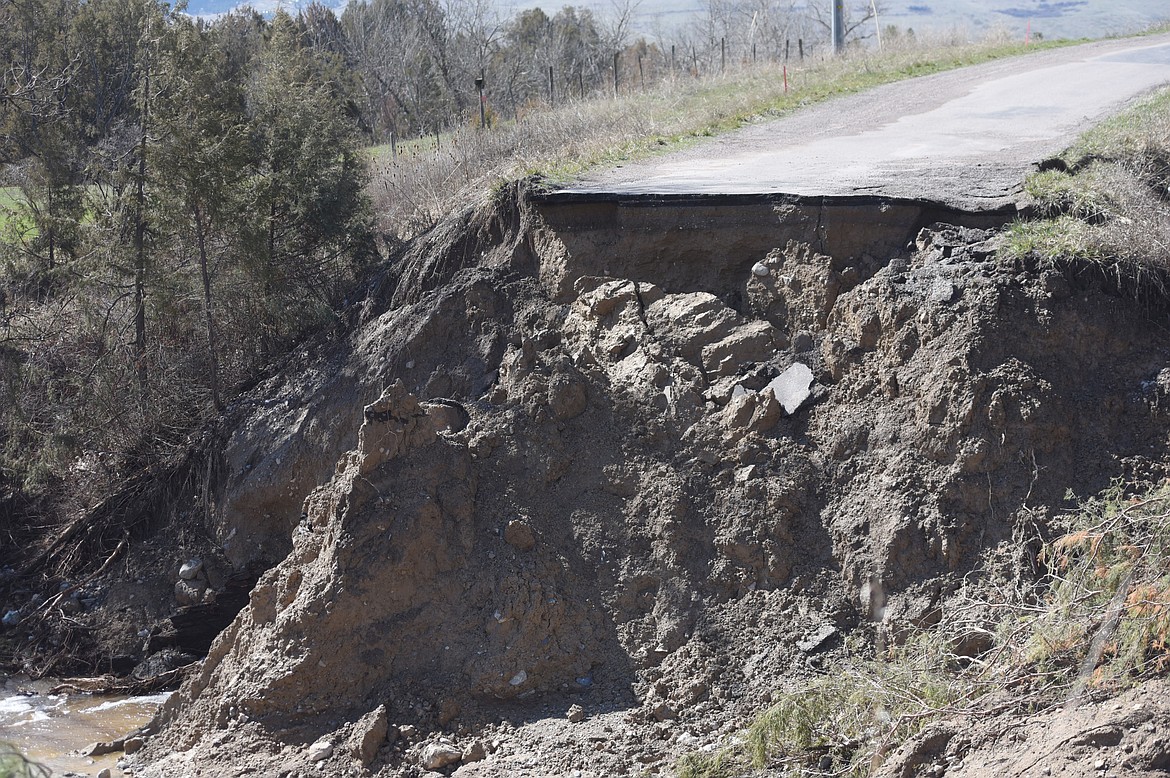 DUBLIN GULCH Road was separated by floodwaters just more than a week ago. Now there is just a slow flow of water through the gulley below the pavement. (Joe Sova/Lake County Leader)