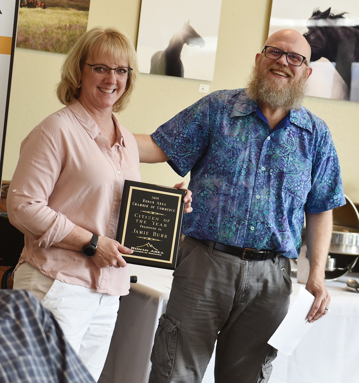 RONAN BOARD member Heather Gray receives the Ambassador of the Year award from Chamber Manager  Brian Burgquist.