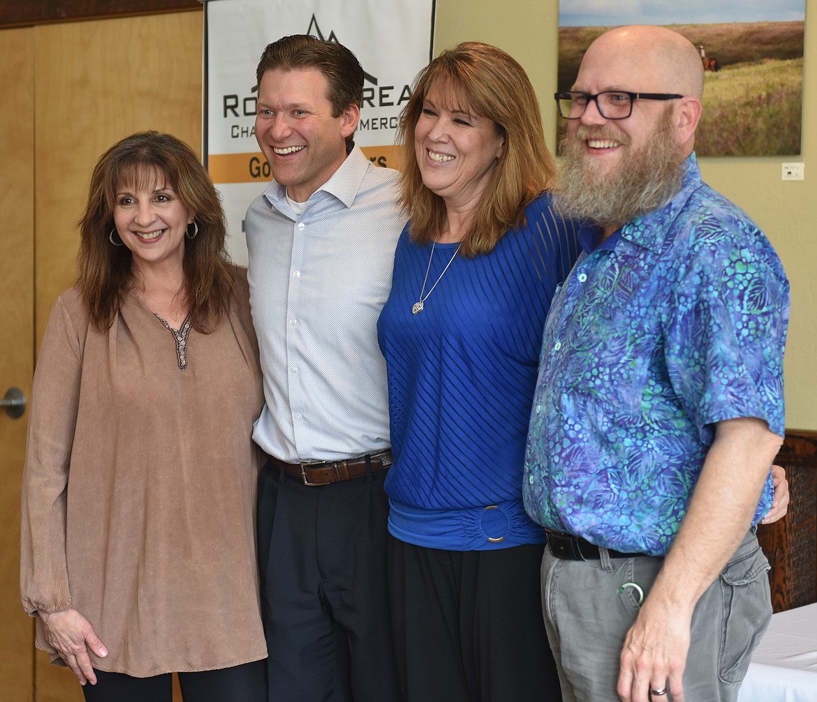 Valley Bank of Ronan, noted for the volunteerism of its employees, was recognized as Business of the Year by the Ronan Chamber of Commerce. Pictured, from left, are Kim Snyder, Jaime Buhr, and Cathy Marmon of Valley Bank, and Chamber Manager Brian Burgquist.