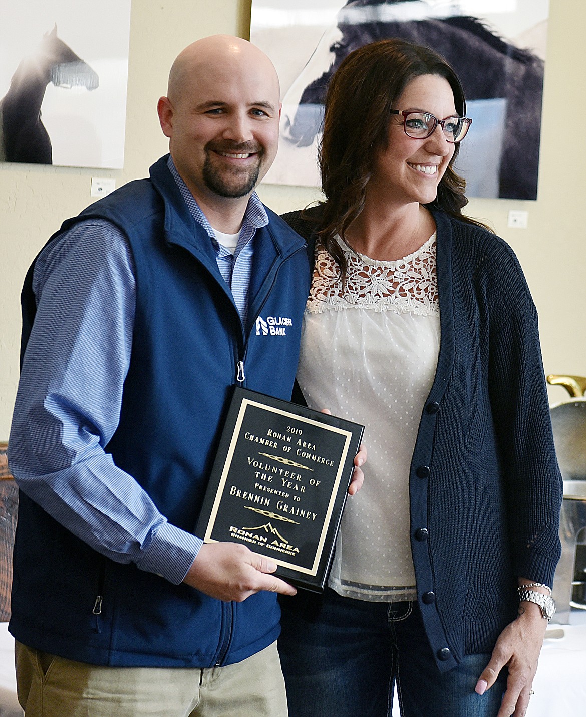 BRENNIN GRAINEY receives one of the two Volunteer of the Year awards from Ronan Chamber member Lacy Cates.