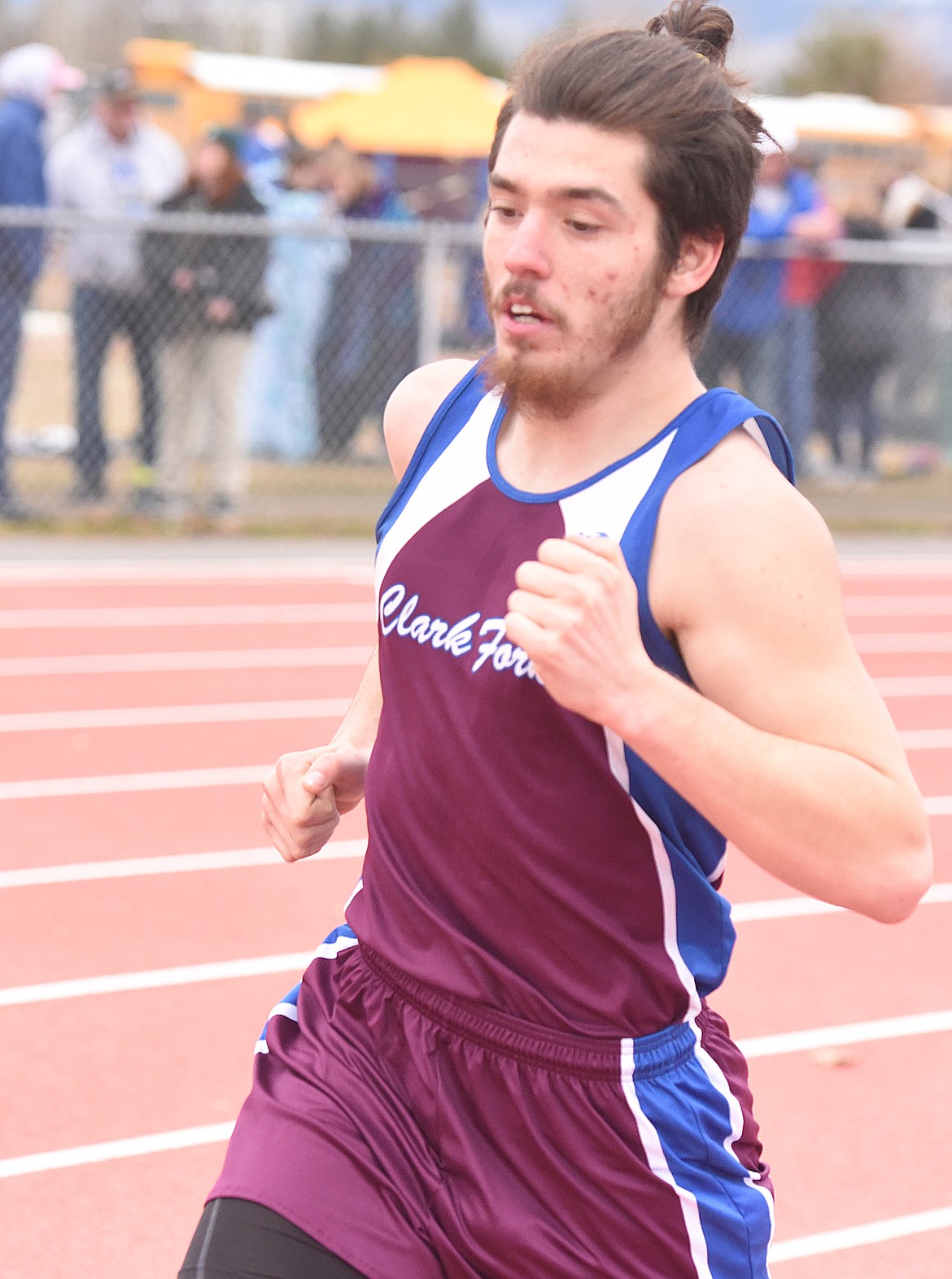 JESSE SHASKE of Clark Fork rounds the first curve in the 1,600-meter run last Saturday at the Frenchtown Invitational Track Meet at Big Sky High School. (Joe Sova/Mineral Independent)