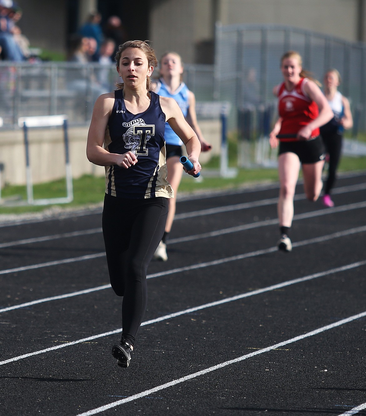 Timberlake High&#146;s Jeana Craven approaches the finish line in the 4x200-meter relay at the Timberlake Invitational.