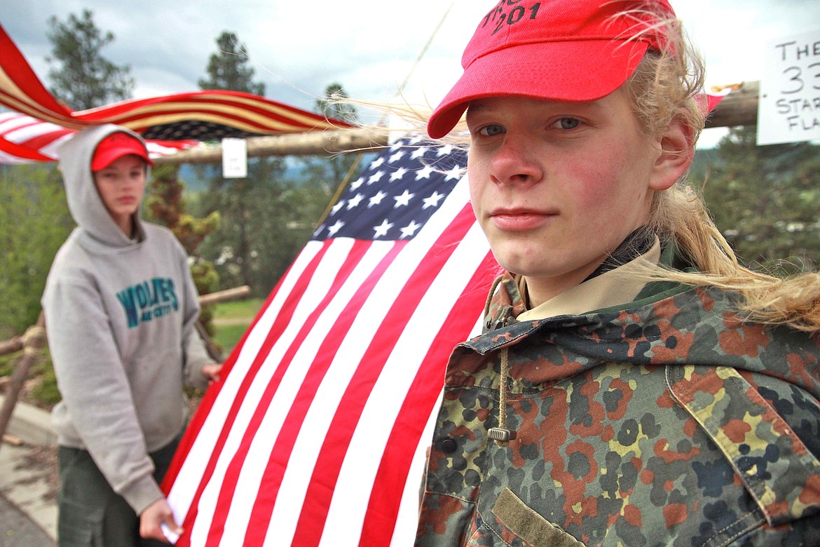 RALPH BARTHOLDT/Press
Boy Scouts Taylor Izzard (front) and Xander Clark of Coeur d&#146;Alene&#146;s Troop 201 watch over a historical U.S. flag exhibit at Saturday&#146;s Scout-O-Rama event.