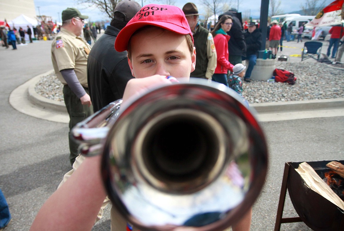 RALPH BARTHOLDT/Press
Daniel Dolan, a Lakes Middle School student, plays 'Taps' during a flag retirement event at Saturday's Scout-O-Rama at Cabelas at Stateline.