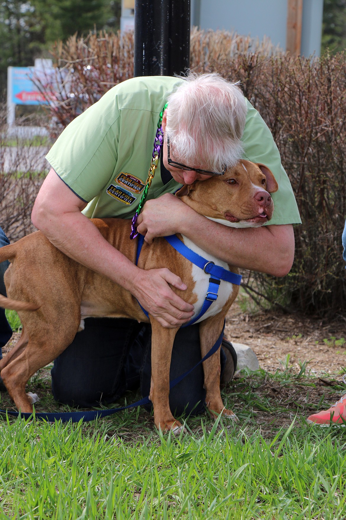 (Photo by CAROLINE LOBSINGER)
Veterinarian Dr. Marty Becker gives Lazaruff a hug. The pup, who had been placed on the Panhandle Animal Shelter&#146;s Home to Home website, was quickly adopted by a couple who saw his profile.