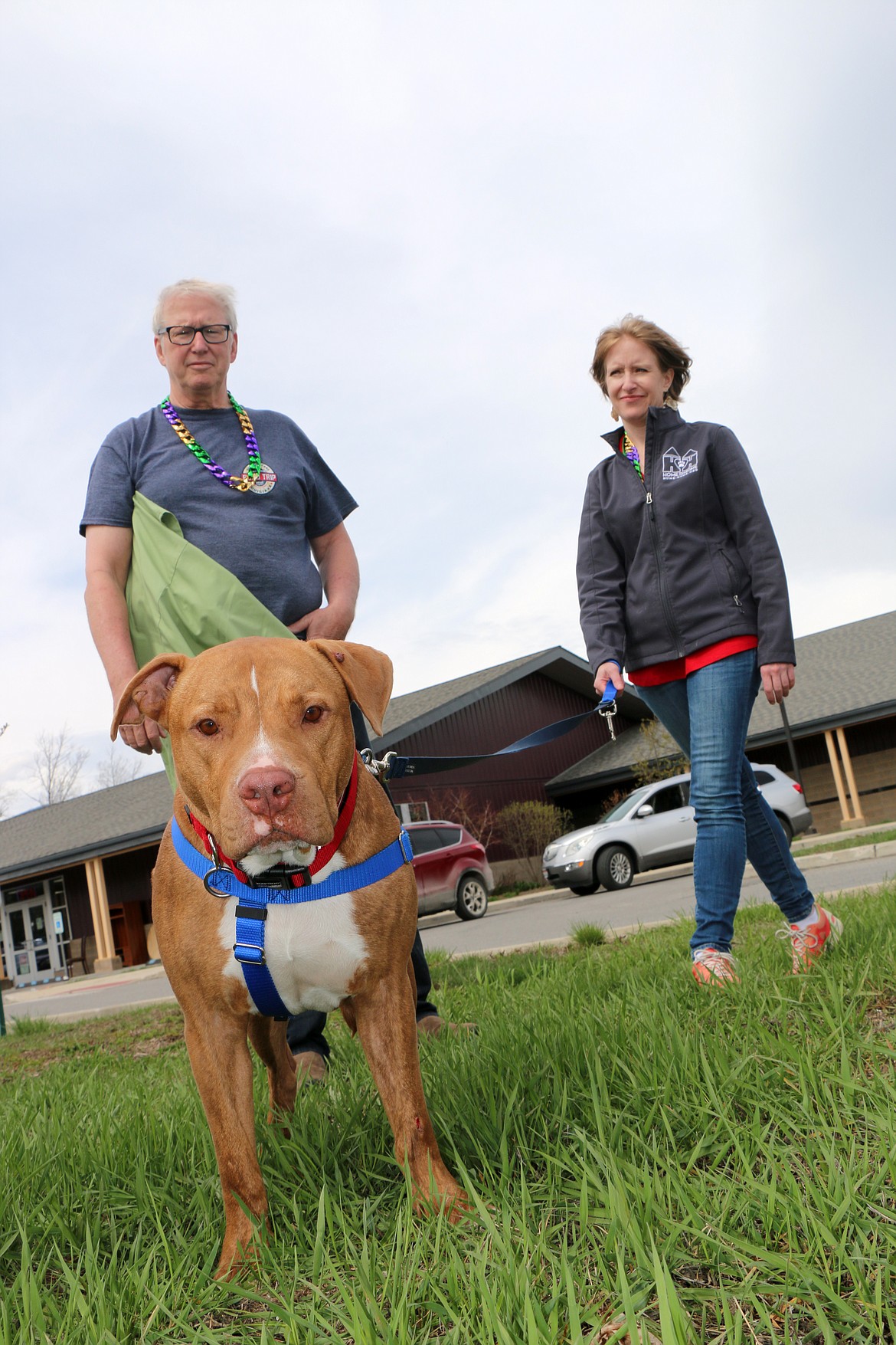 (Photo by CAROLINE LOBSINGER)Lazaruff enjoys a moment with veterinarian Dr. Marty Becker and Mandy Evans, executive director of the Panhandle Animal Shelter. after making it home to Sandpoint after a nine-month recovery following his discovery in an abandoned home in Louisiana.