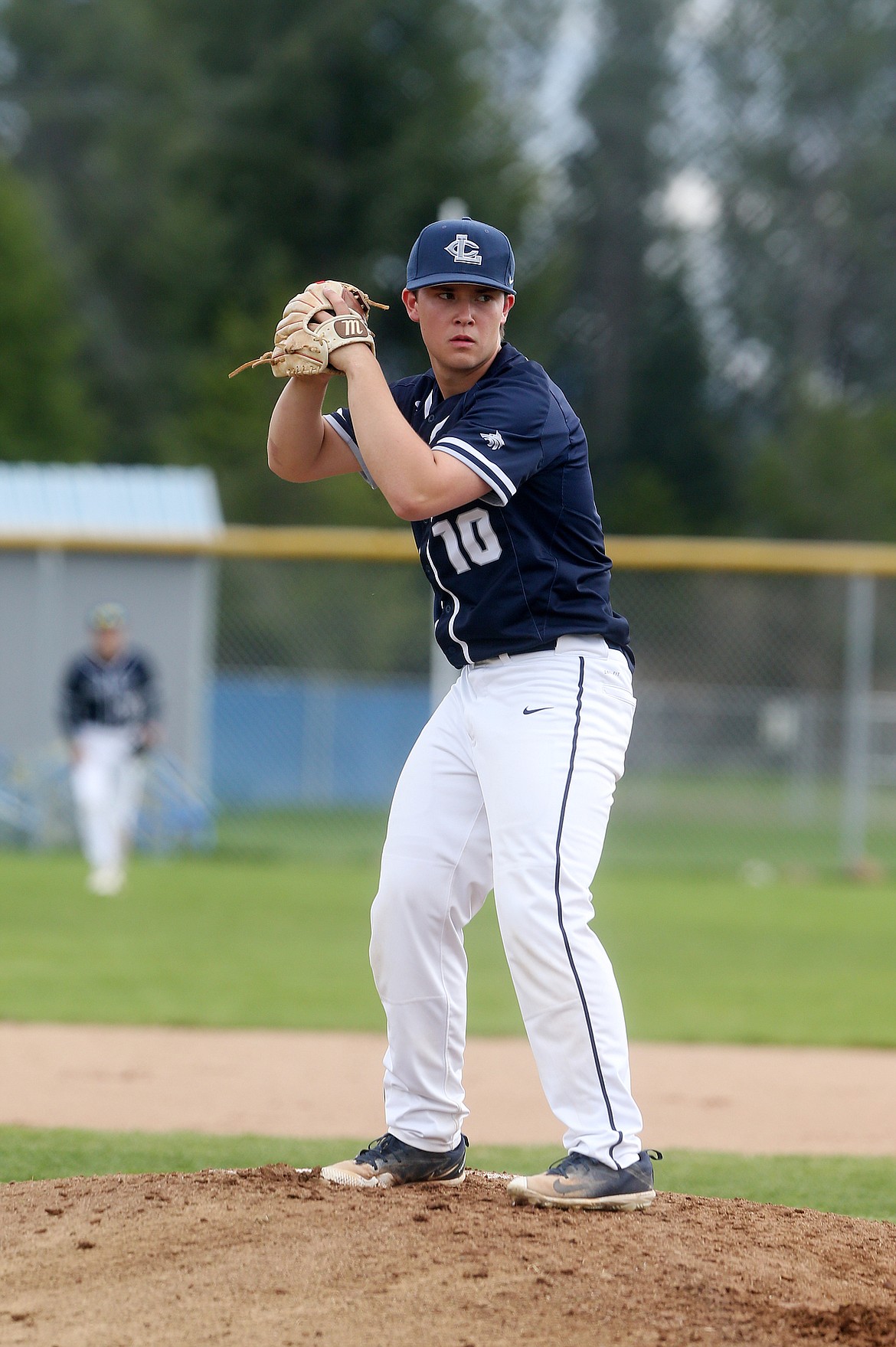 Lake City&#146;s Brock Sween goes through his windup before delivering a pitch in Tuesday&#146;s game against Coeur d&#146;Alene High. (LOREN BENOIT/Press)