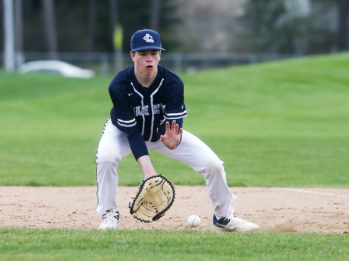 Lake City first baseman Payton Childers fields a grounder in a game against Coeur d&#146;Alene High on Tuesday. (LOREN BENOIT/Press)
