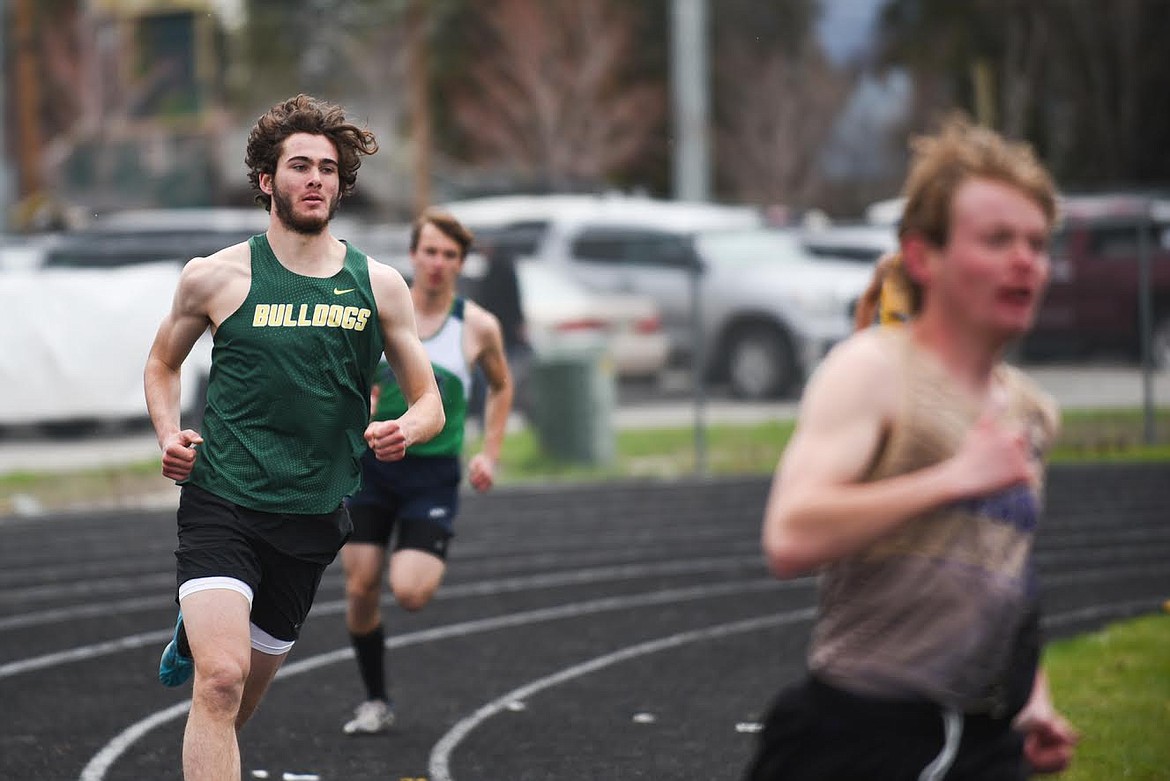 Whitefish's Sam Menicke races in the 400 meter dash on a rainy A.R.M. Invitational Saturday at Whitefish.