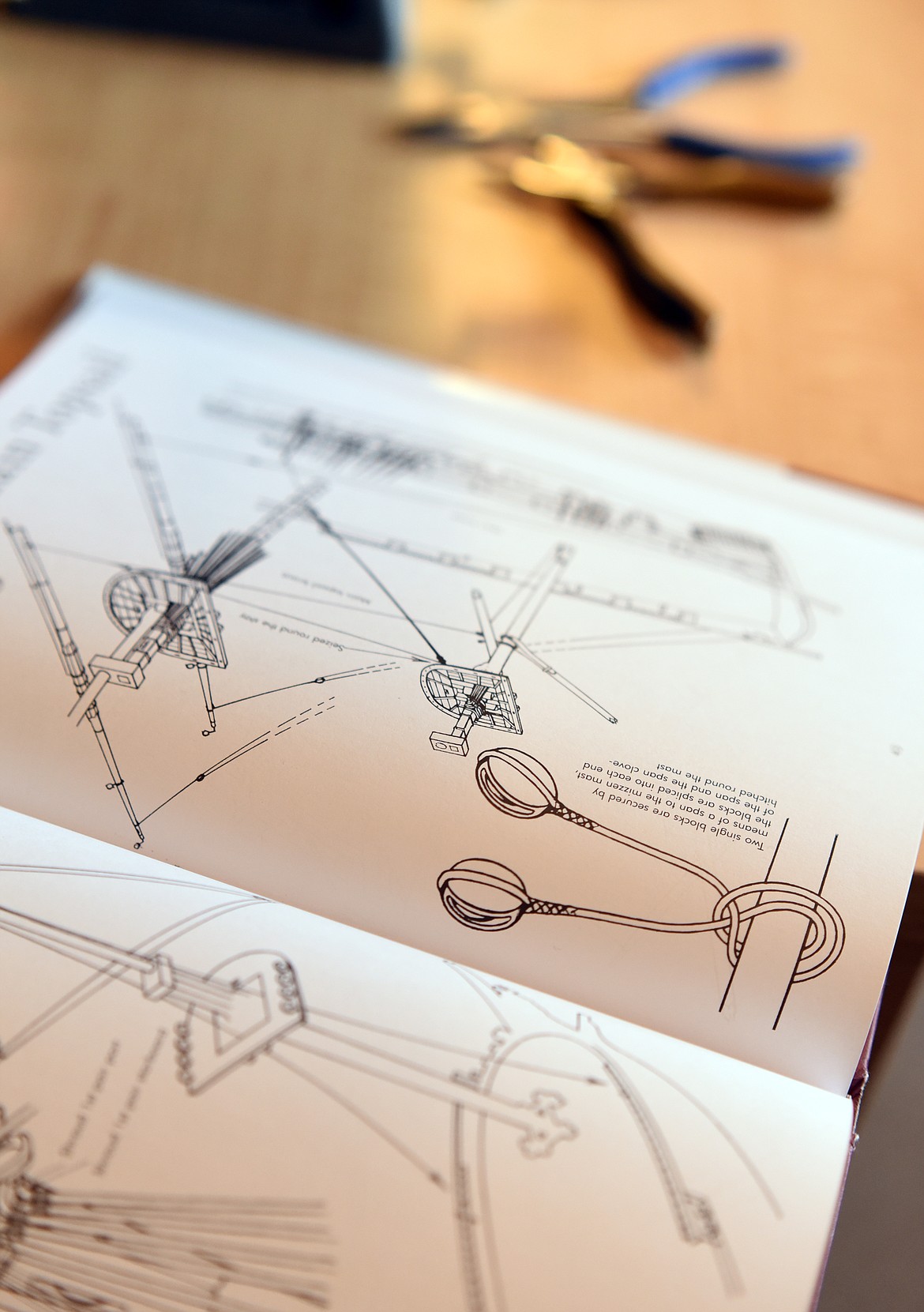 A book on rigging and some of the tools Allen Daffern uses to make his to scale model ships at his home in Kalispell.(Brenda Ahearn/Daily Inter Lake)