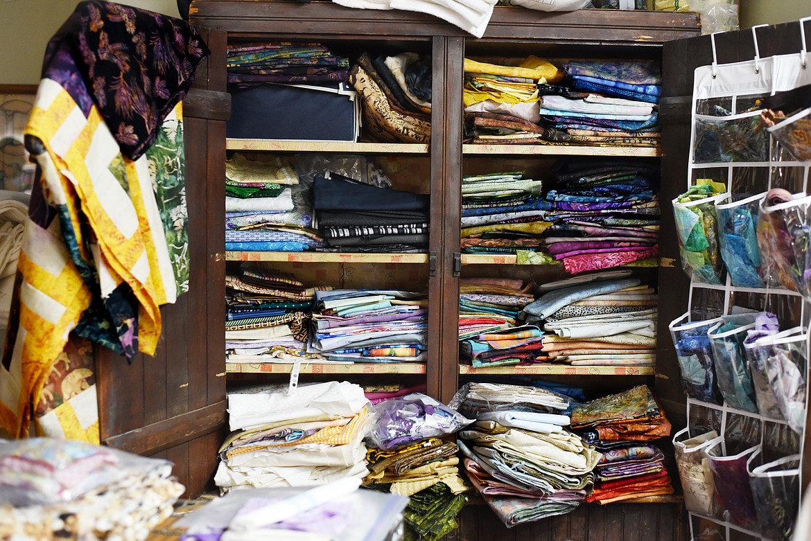 The basement of Sherry Wheeler&#146;s home has been turned into a space that many visitors have referred to as &#147;the factory.&#148; On one wall, she has used a cabinet, which formerly served as a kitchen cabinet for her grandmother, as another storage space for her collection of fabric.