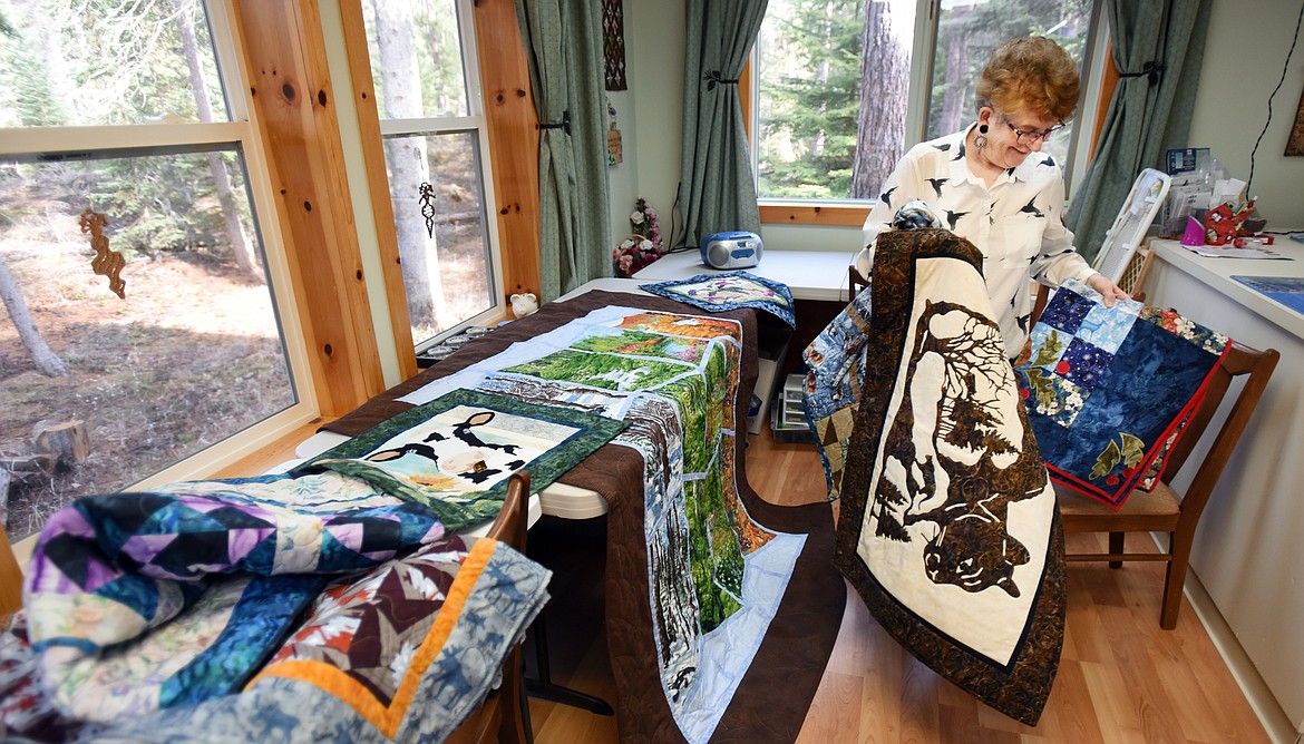 Featured Quilter Sherry Wheeler lays out some of her quilts at her home. Most of Wheeler&#146;s quilts become presents that she prefers to give away. (Brenda Ahearn photos/Daily Inter Lake)