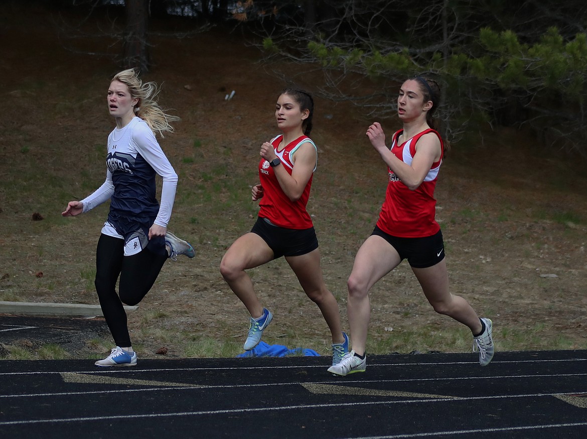 KYLE CAJERO/Bonner County Daily Bee
From left, Emmaline Pinkerton (Bonners Ferry), Bionce Vincent (Sandpoint) and Josie Yovichin (Coeur d&#146;Alene Charter) compete in the girls 400 meters at the Priest River Invitational on Saturday.