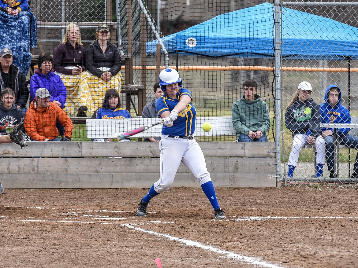 Libby senior Sammee Bradeen swings at her first home run Saturday at home against Ronan. (Ben Kibbey/The Western News)