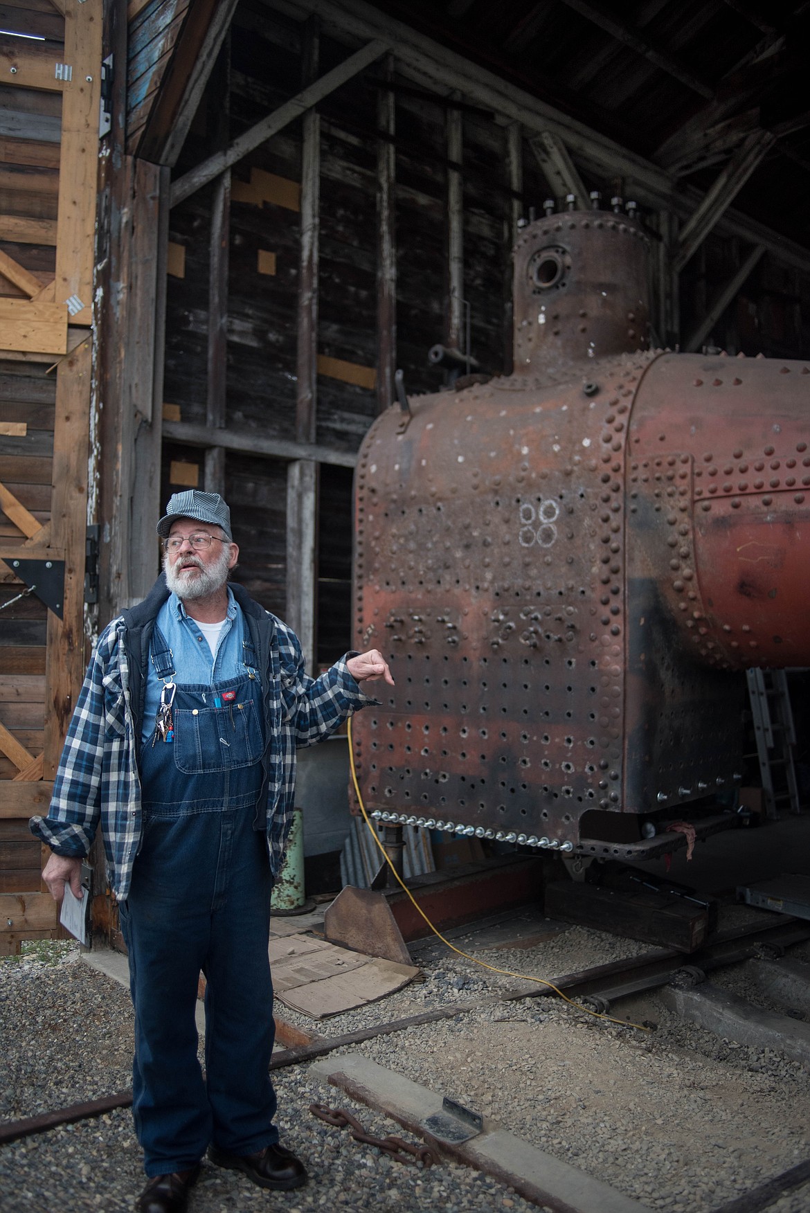 August Hardgrove, a Heritage Museum volunteer, talks about a Shay locomotive he has been repairing, April 18, at the museum in Libby. (Luke Hollister/The Western News)