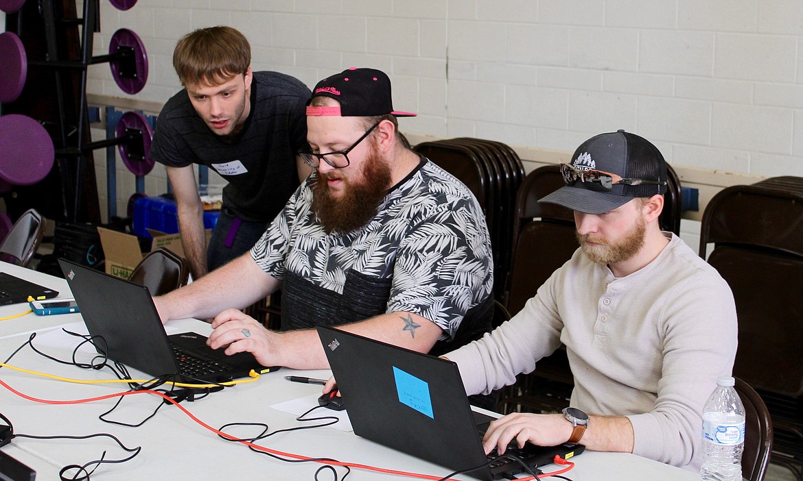 Photo by ANDY HELKEY
From left: Jared Christiansen guides Shoshone News-Press staff reporter Josh McDonald and Managing Editor Chanse Watson through the first few quests of the game.