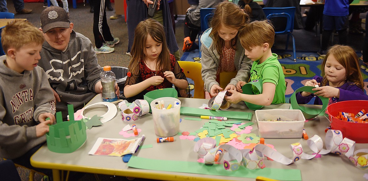 KIDS WERE busy making hats and other headwear during the Night of the Arts on April 18 at Cherry Valley Elementary. The kiddos were quite creative with their projects.