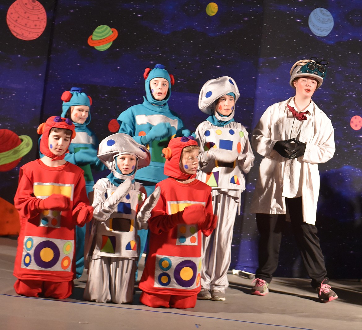 MANICAL SCIENTIST of Lapunta (Anna Hafner, right) and Robots of Lapunta (from left, Marina Tulloch, Tia Bellinger, Melodie Cook, Asher Seymour, Annika Ercanbrack, Greg Tatum) are part of a colorful cast.