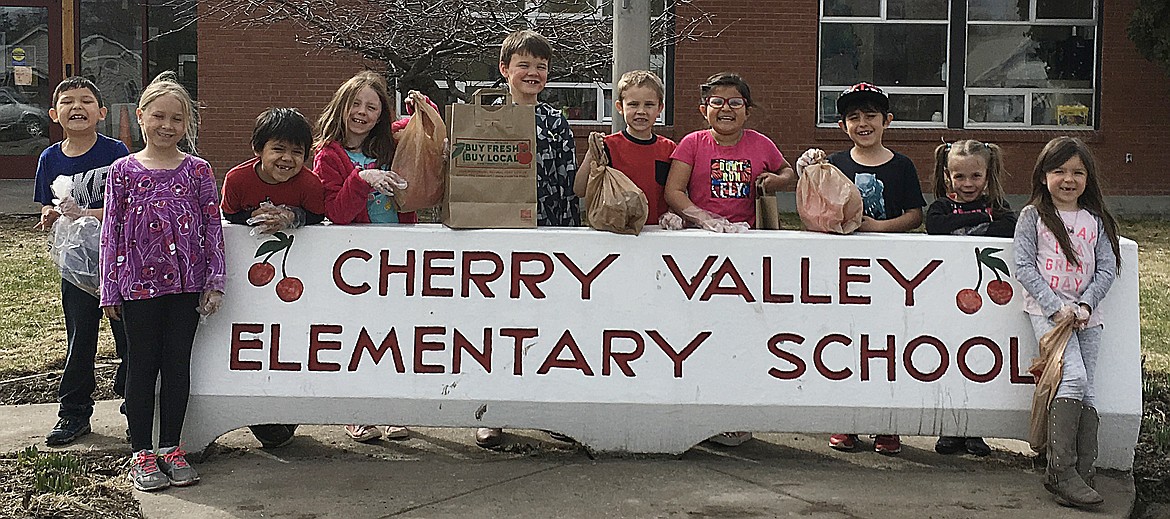 CHERRY VALLEY Elementary students got an early start to the Clean Up! Green Up! event coming up May 3-5 by picking up trash around the school earlier this month. Pictured from left are CVE students Avery, Mykala, DJ, Liz, Crosby, Dylan, Kollyn, Andre, Remington and Paisley. (Photo courtesy of Cherry Valley Elementary School)