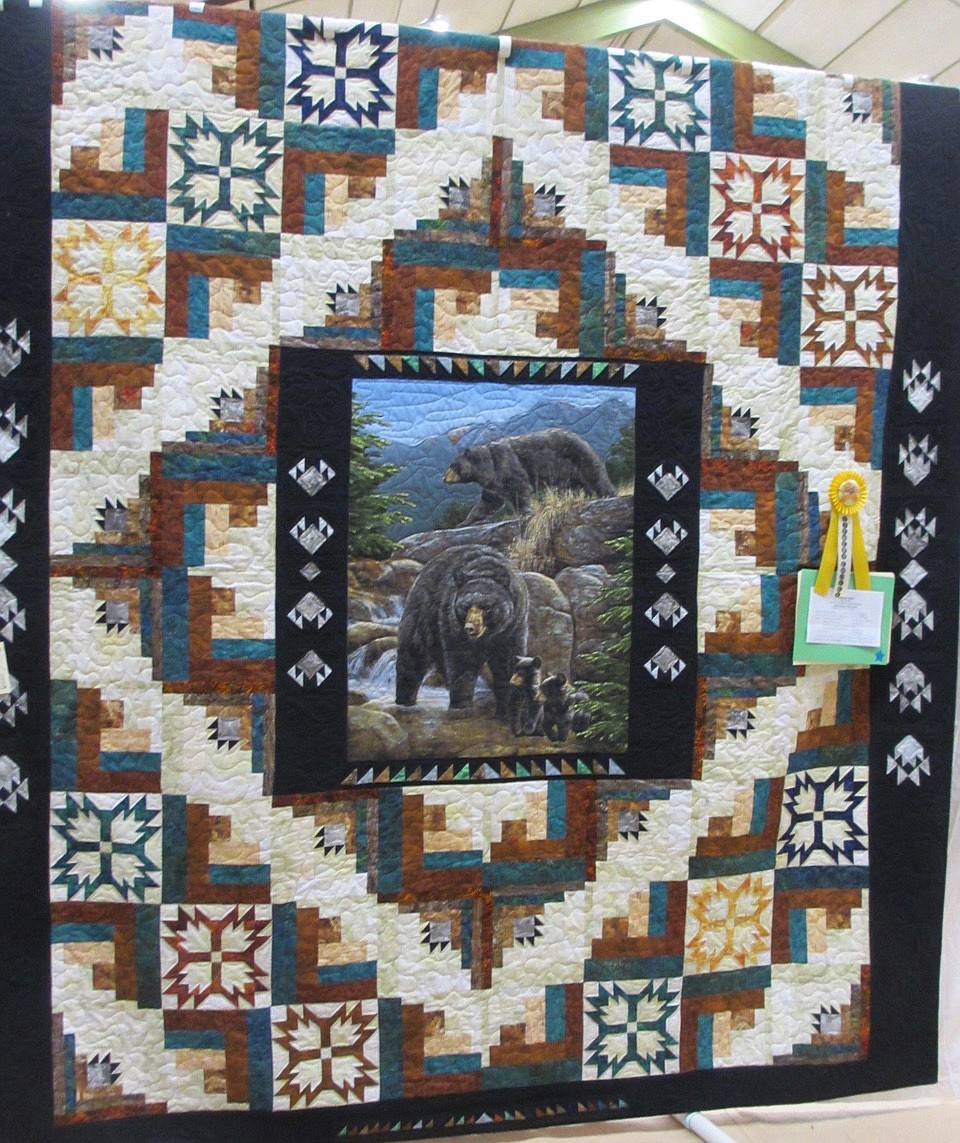 PEG McCARTHY of Plains earned the &#147;Viewer&#146;s Choice&#148; award for the top entry in the 2019 Flat Iron Quilt Guild&#146;s show held Saturday, April 6 in the Thompson Falls High School gymnasium. Her intricate, pictureque quilt is pictured above. (Photo courtesy of Flat Iron Quilt Guild)