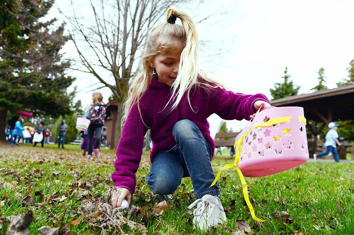 A child races to scoop up eggs at Marantette Park.