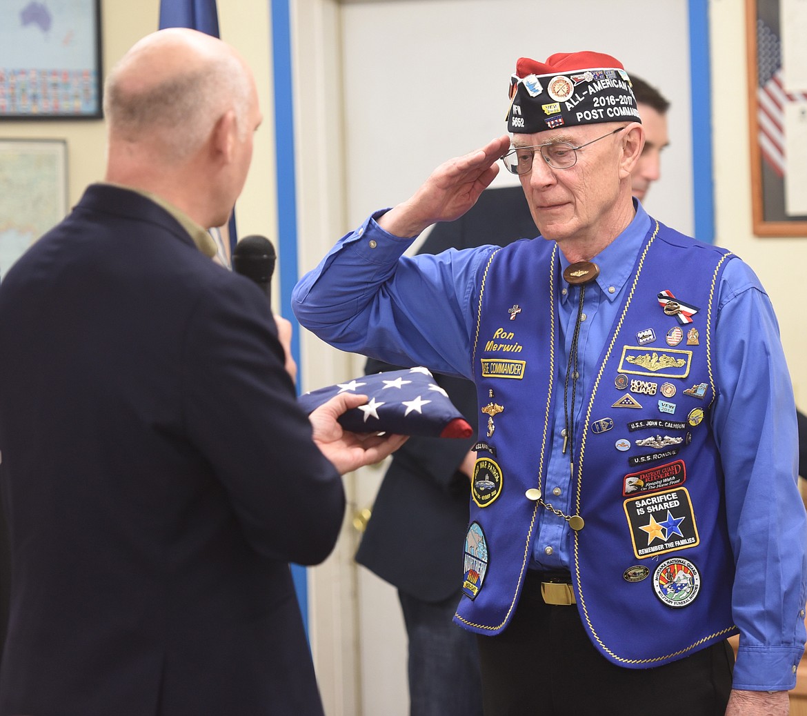 RON MERWIN salutes U.S. Congressman Greg Gianforte and the folded U.S. flag he received to conclude the Montana Congressional Veteran Commendaton presentation. (Joe Sova photo/Lake County Leader)