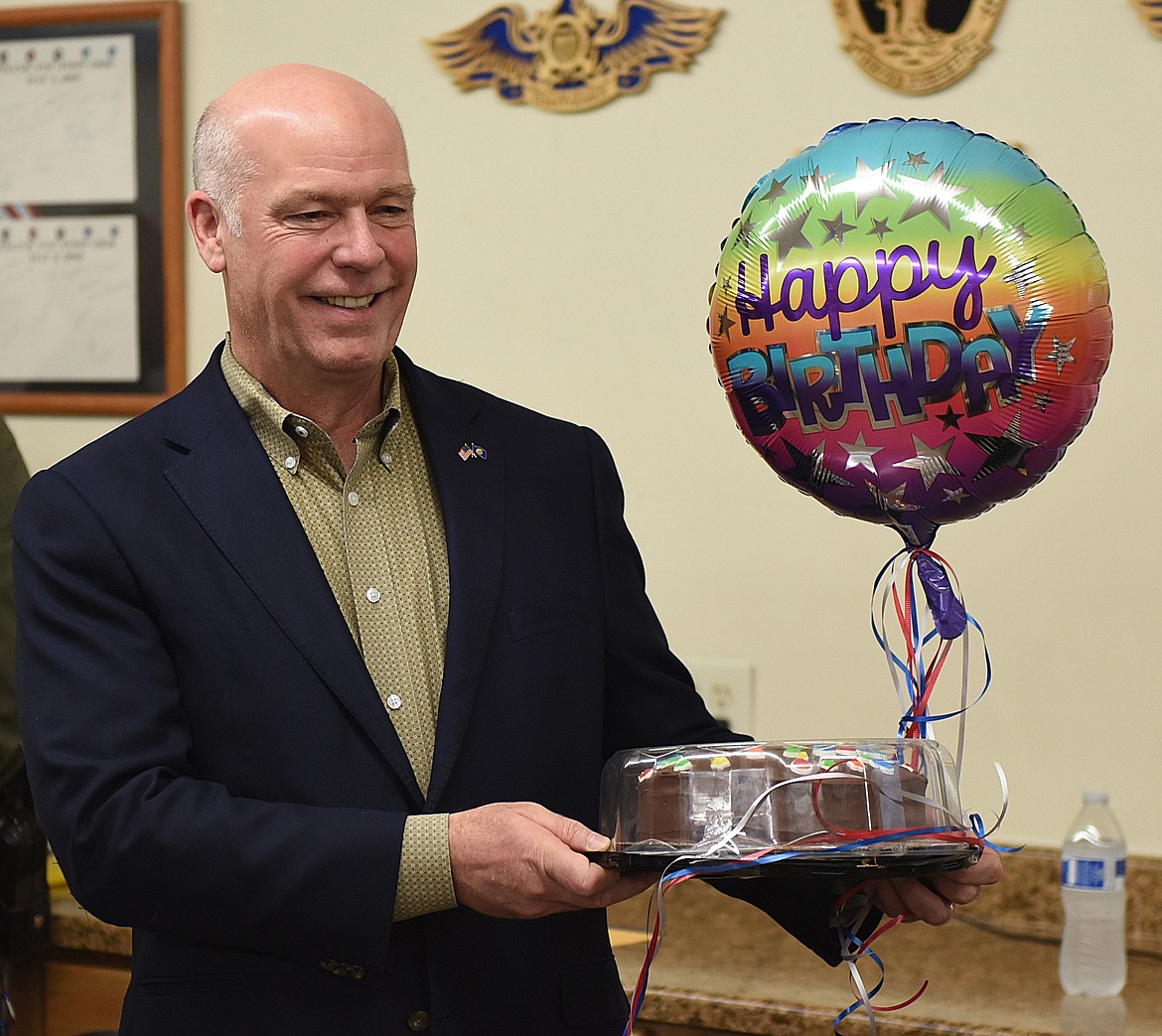 U.S. CONGRESSMAN Greg Gianforte is all smiles as he receives a cake and balloon to celebrate his birthday during his visit to Ronan on April 17.