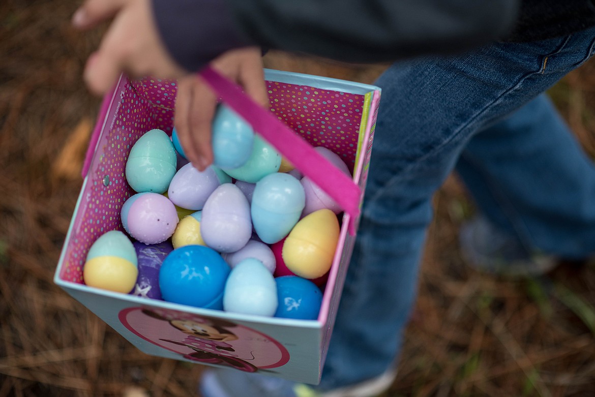 Children were quick to fill up their baskets during the Easter Eggstravaganza Egg Hunt, Saturday at the Libby Christian Church. (Luke Hollister/The Western News)