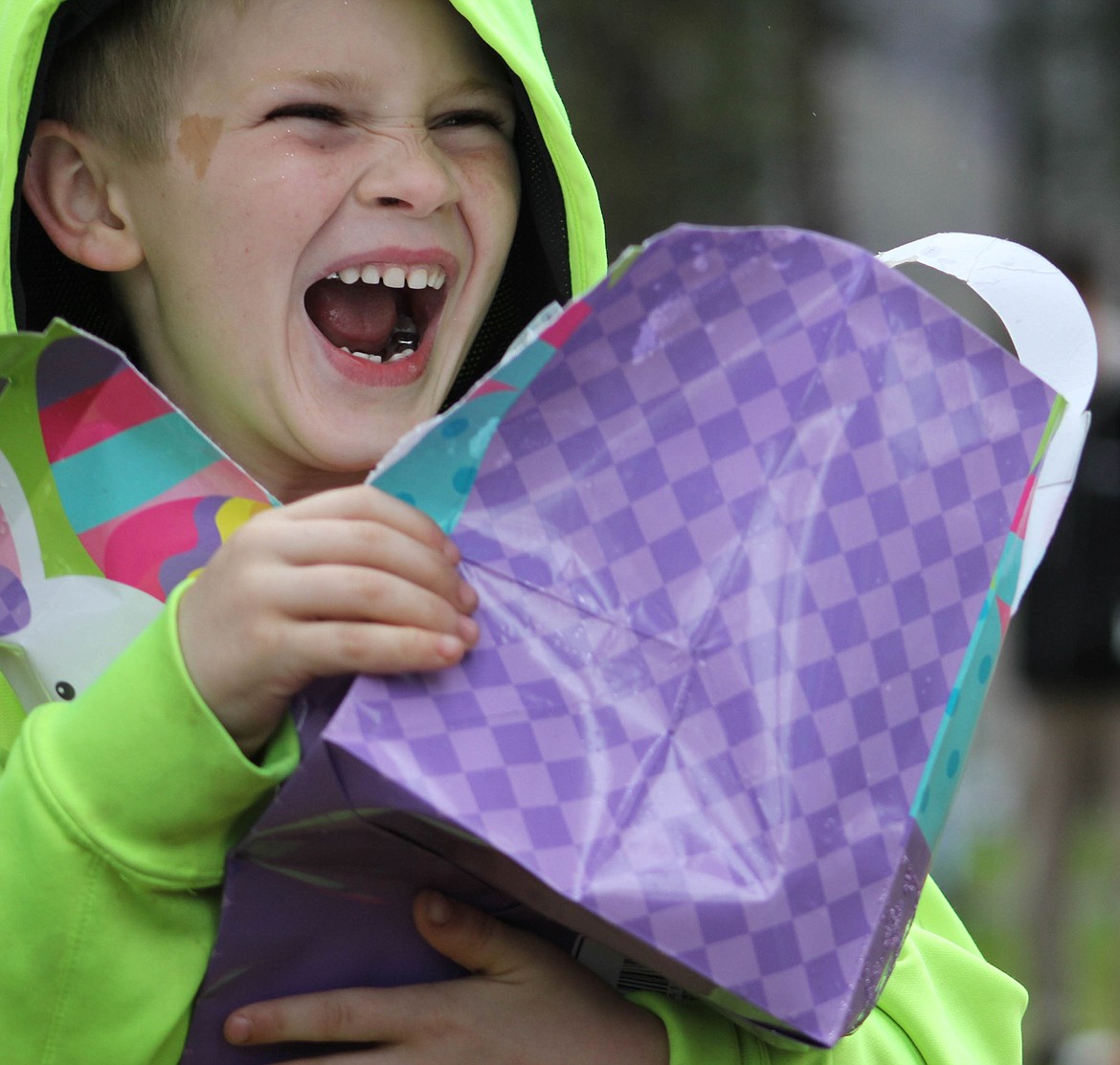 SIX-YEAR-OLD Phoenix Bridwell is elated after receiving his Easter winnings at Superior&#146;s Easter Egg Hunt on Saturday, April 20. (Maggie Dresser/Mineral Independent)