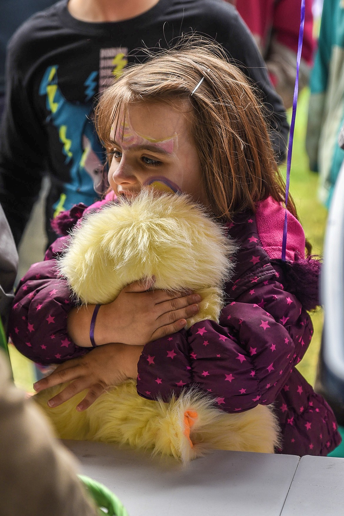 Gretta Tackett hugs the stuffed doll -- a large baby chick -- that she won during the Easter egg hunt at Roosevelt Park in Troy Saturday. Tackett was very pleased with her prize, though she said, &#147;Actually I love Easter bunnies.&#148; (Ben Kibbey/The Western News)