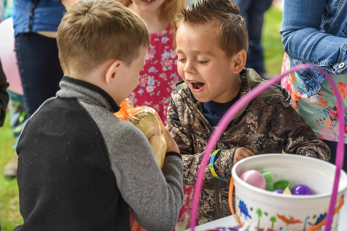 Finn Orr and Keeler Davis share excitement over Finn&#146;s stuffed shark prize from the Easter egg hunt at Roosevelt Park in Troy Saturday. (Ben Kibbey/The Western News)
