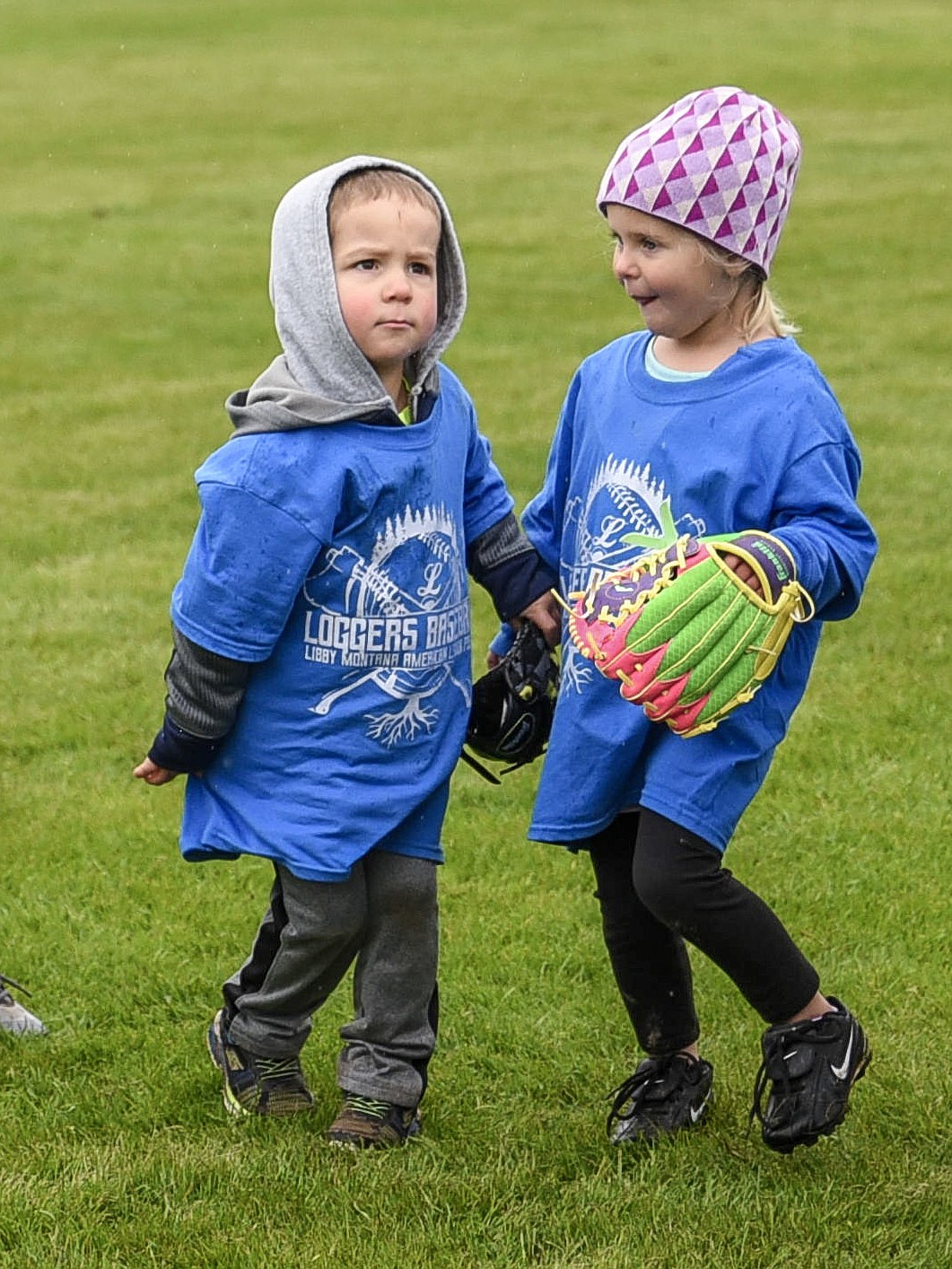 Maverick Grotjohn and Emerson Spencer get ready to practice fielding a ground ball at the Libby Loggers Kids Camp Saturday at Lee Gehring Field. (Ben Kibbey/The Western News)