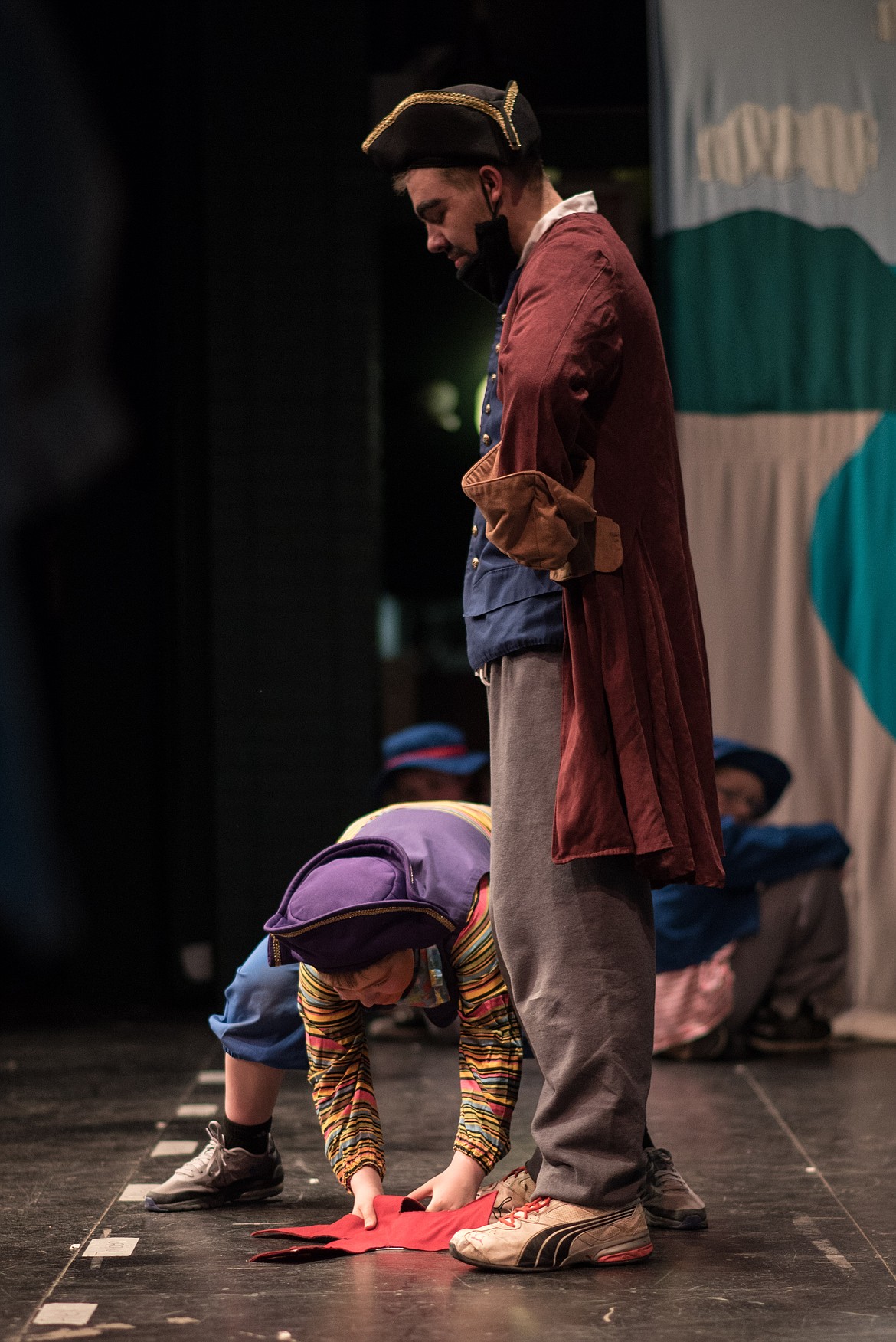 Teague Thompson (left) acting as Peachfuzz, and Kevin Carberry, as Blackbeard, mark the ground with an &#147;X&#148; while performing Blackbeard the Pirate, Saturday. (Luke Hollister/The Western News)