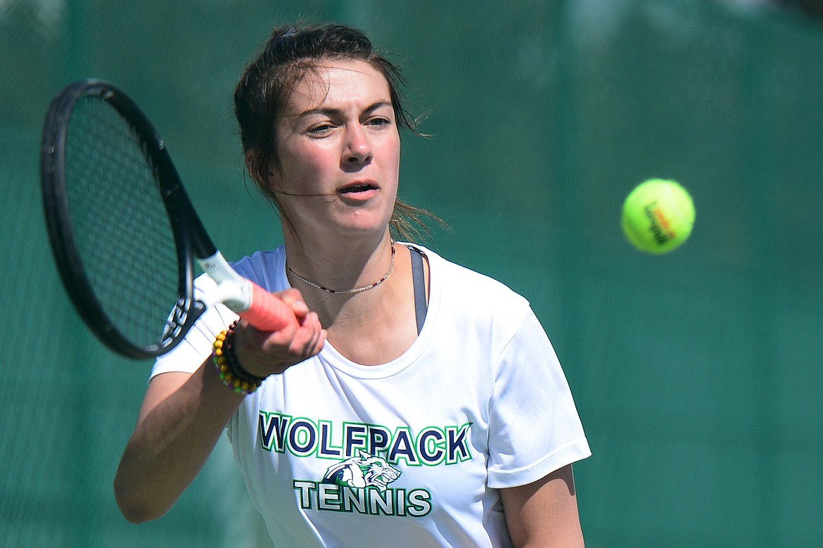 Glacier's Maggie Rudbach hits a return against Flathead's Kendall Pyron during crosstown tennis at Flathead Valley Community College on Tuesday. (Casey Kreider/Daily Inter Lake)