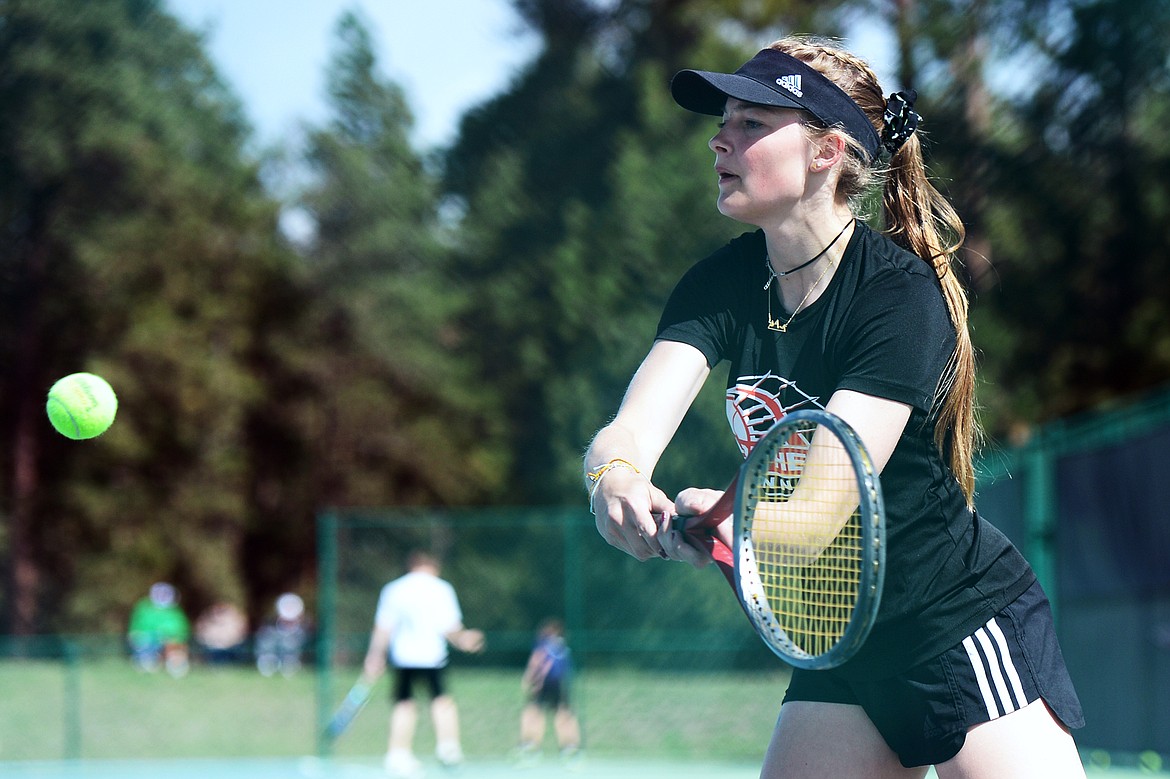 Flathead's Kendall Pyron hits a return against Glacier's Maggie Rudbach during crosstown tennis at Flathead Valley Community College on Tuesday. (Casey Kreider/Daily Inter Lake)