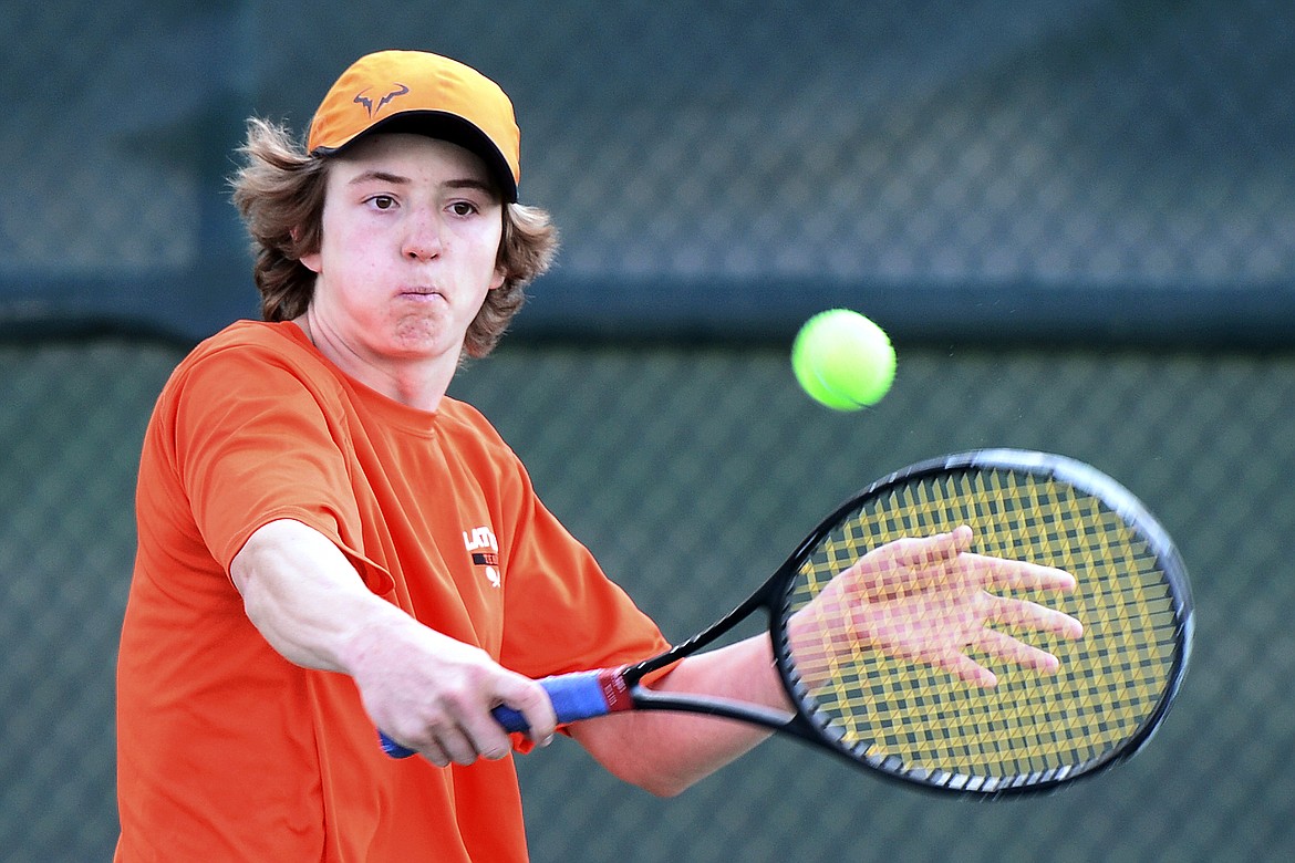 Flathead's Joston Cripe hits a return against Glacier's Rory Smith during crosstown tennis at Flathead Valley Community College on Tuesday. (Casey Kreider/Daily Inter Lake)